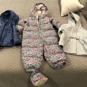 2 jackets, 1 snowsuit with booties and gloves.